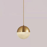 Modern Brass and Textured Glass Globe Pendant Light Image - 9