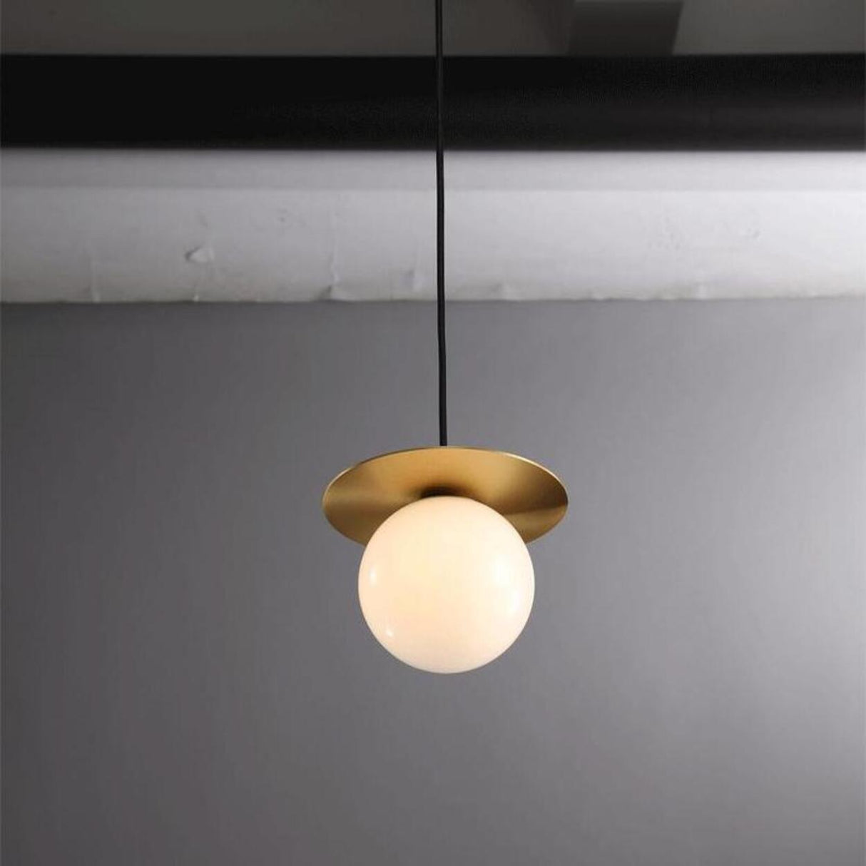 Modern Brass Disc White Glass Globe Pendant Light Image - 12