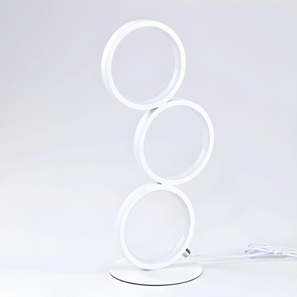 Modern Chic Triple Circle LED Metal Frame Table Lamp Image - 6