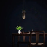 Modern Dining Room Capsule-Shaped Grey Glass Pendant Light Image - 1