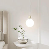 Modern Minimalist White Metal Sleek Globe Pendant Light Image - 1