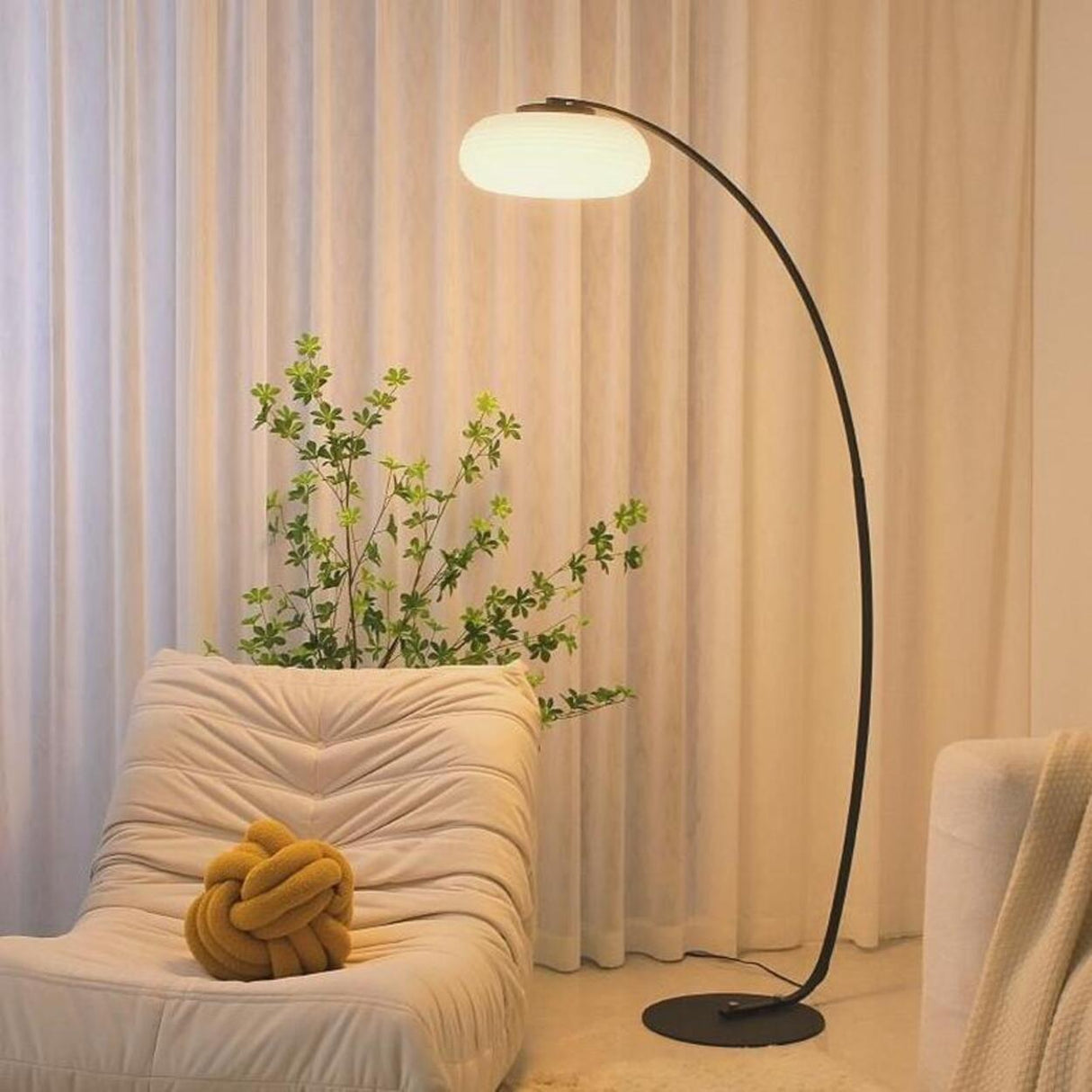 Modern Round and Black Arched Metal LED Floor Lamp Image - 1