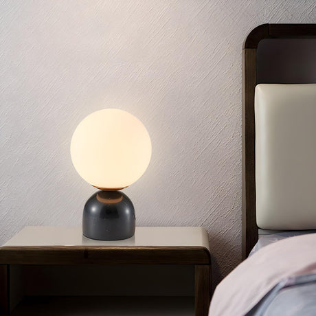 Modern Simple White Globe Ceramic Black Base Table Lamp Image - 1