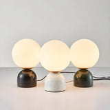 Modern Simple White Globe Ceramic Black Base Table Lamp Image - 6