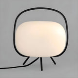 Modern White Globe Glass Shape Black Frame Table Lamp Image - 6