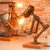 Retro Industrial Pipe Robot Wooden Base Table Lamp Image - 2