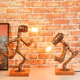 Retro Industrial Pipe Robot Wooden Base Table Lamp Image - 8