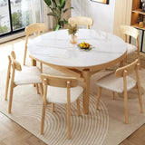 Scandinavian Round Stone Dining Table Self-Storing Leaf Image - 3