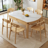 Scandinavian Round Stone Dining Table Self-Storing Leaf Image - 7