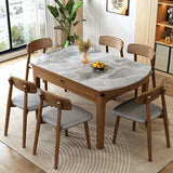 Scandinavian Round Stone Dining Table Self-Storing Leaf Image - 8