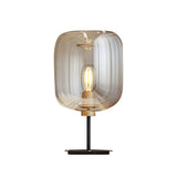 Simple Amber Drum Glass Shade Black Base Table Lamp Image - 5