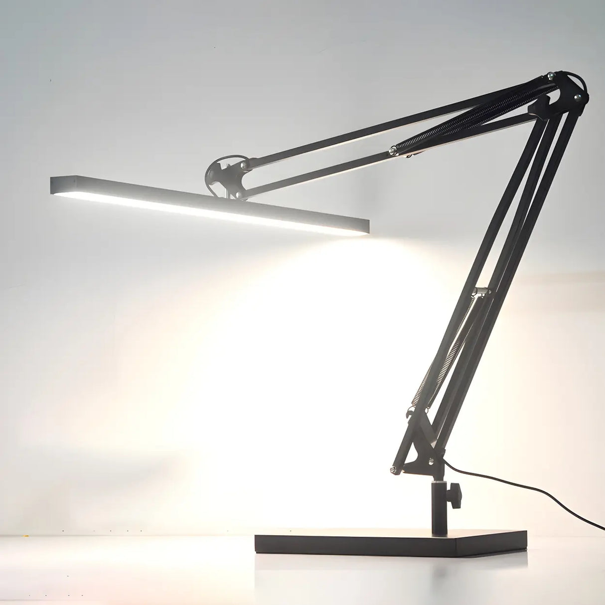 Simple Black Linear Adjustable Metal Arm Table Lamp Image - 3