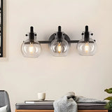 Simple Clear Glass Globe Black 3-Bulb Wall Vanity Light Image - 1