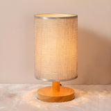 Simple Cylindrical Fabric Shade Wooden Base Table Lamp Image - 3