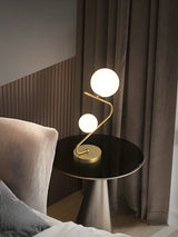 Simple Dual Opal Glass Globes Brass Curved Table Lamp Image - 12