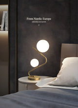 Simple Dual Opal Glass Globes Brass Curved Table Lamp Image - 14