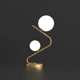 Simple Dual Opal Glass Globes Brass Curved Table Lamp Image - 6