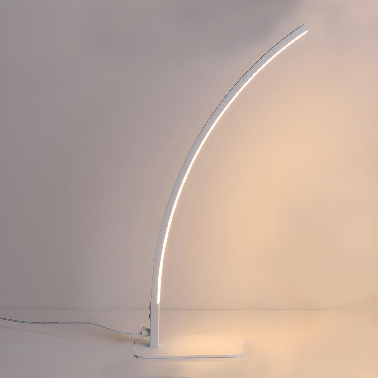 Simple Elegant Curved Linear LED Metal Table Lamp Image - 8