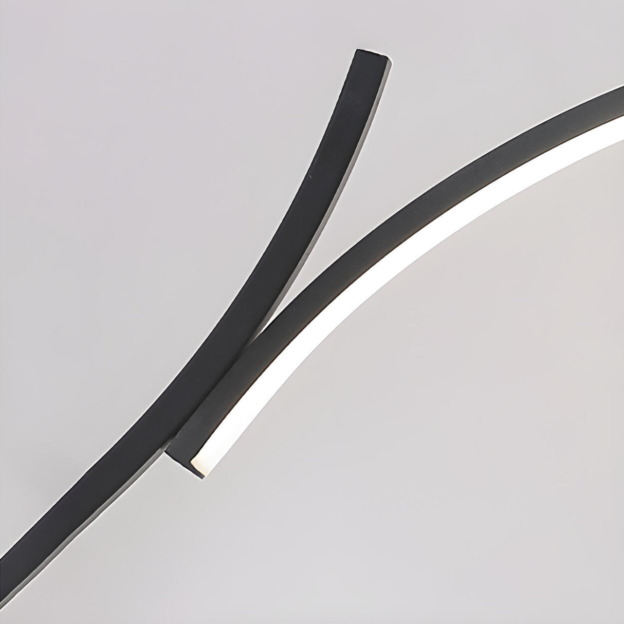 Simple Elegant Curved Linear LED Metal Table Lamp Image - 9