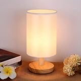 Simple Fabric Cylinder Shade Wooden Base Table Lamp Image - 1