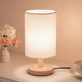 Simple Fabric Cylinder Shade Wooden Base Table Lamp Image - 13