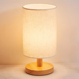 Simple Fabric Cylinder Shade Wooden Base Table Lamp Image - 6