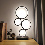 Simple Stylish Black Round 4 Lights LED Table Lamp Image - 1