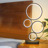 Simple Stylish Black Round 4 Lights LED Table Lamp Image - 3