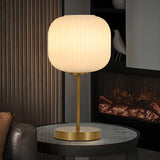 Simple White Modern Glass Lantern Brass Base Table Lamp Image - 1