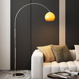 Sleek Adjustable Amber Glass Globe Arched Floor Lamp Image - 2