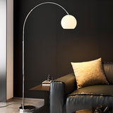 Sleek Adjustable Amber Glass Globe Arched Floor Lamp Image - 3