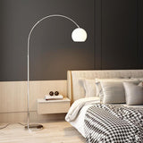 Sleek Adjustable Amber Glass Globe Arched Floor Lamp Image - 4