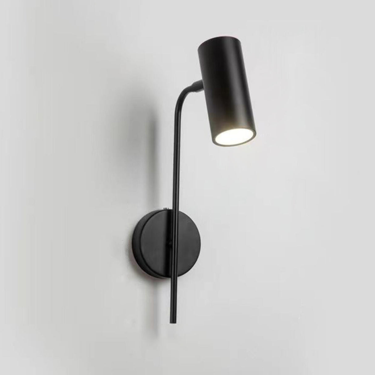 Sleek Black Cylinder Bedside Adjustable Wall Sconce Image - 10