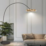 Sleek LED Gold Ring and Arched Metal Floor Lamp Image - 1