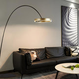 Sleek LED Gold Ring and Arched Metal Floor Lamp Image - 5