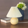 Sleek spherical ceramic pleated lampshade table lamp Image - 3