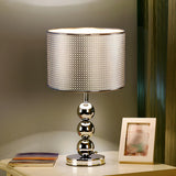 Stylish Geometric Hollow Shade Metal Base Table Lamp Image - 1