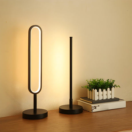 Stylish Minimalist Black Linear Oval LED Table Lamp Image - 1