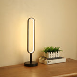 Stylish Minimalist Black Linear Oval LED Table Lamp Image - 2