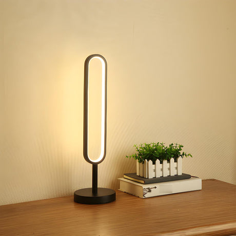 Stylish Minimalist Black Linear Oval LED Table Lamp Image - 2