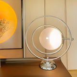 Stylish Silver Round Rotating Moon Metal Table Lamp Image - 1