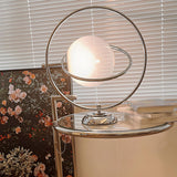 Stylish Silver Round Rotating Moon Metal Table Lamp Image - 3