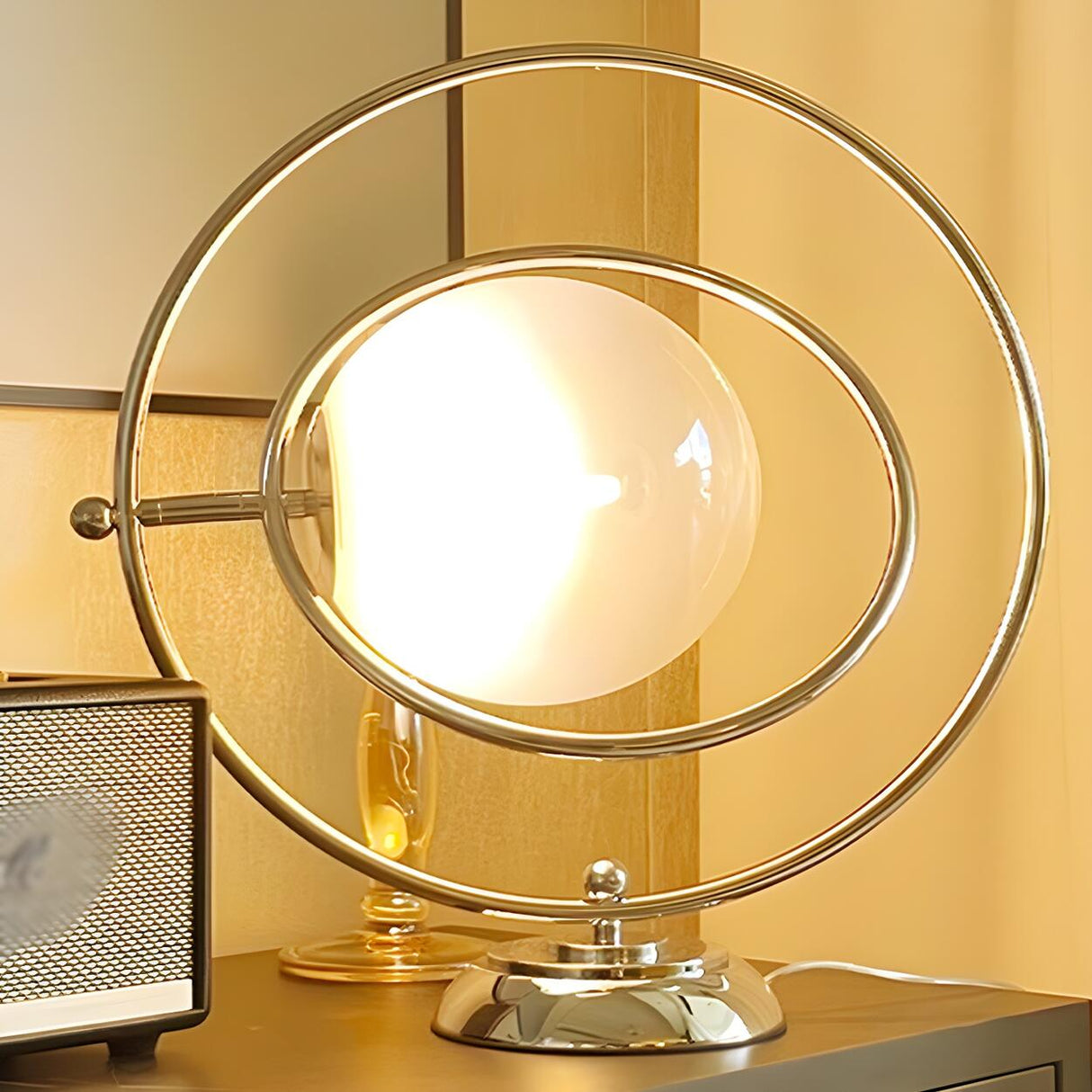 Stylish Silver Round Rotating Moon Metal Table Lamp Image - 4