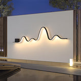 Unique Outdoor Black Linear LED Wave Wall Sconce Image - 3