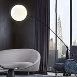 Unique Spherical Shade and Arched Metal Floor Lamp Image - 3