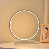 White Minimalism Circular LED Metal Frame Table Lamp Image - 1